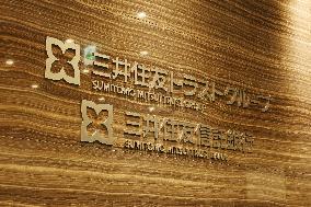 Sumitomo Mitsui Trust Group signboard and logo